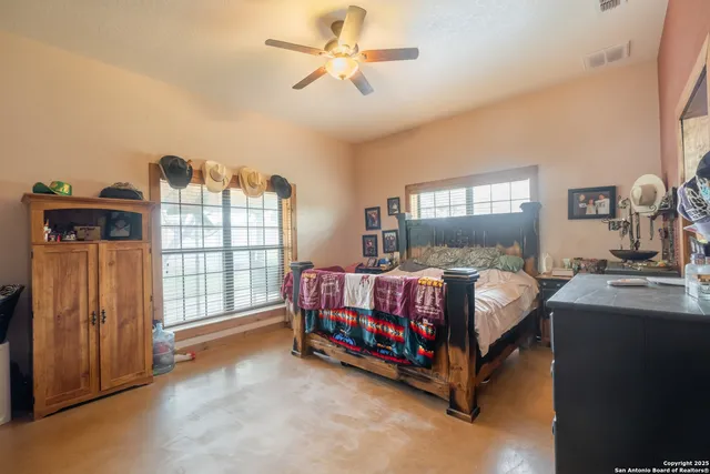 a bed room with a bed and a chandelier