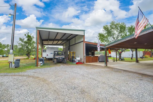 an outdoor space with furniture and garden view
