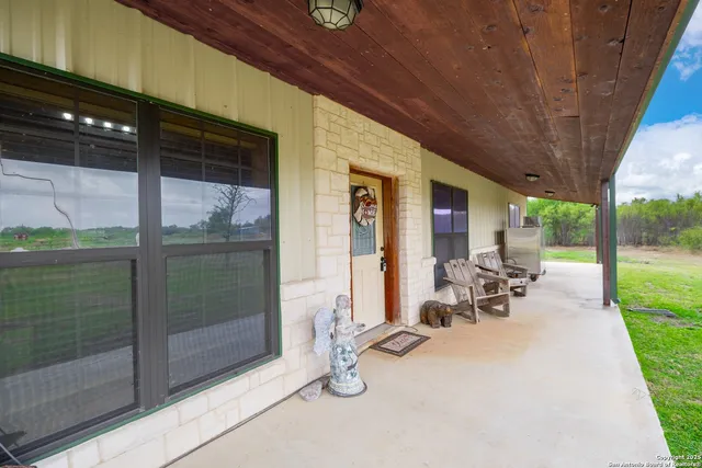 a view of outdoor space with porch and patio