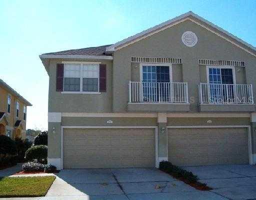 27827 Pleasure Ride Loop Wesley Chapel, FL 33544 - Photo 1 of 1 a front view of a house with outdoor space