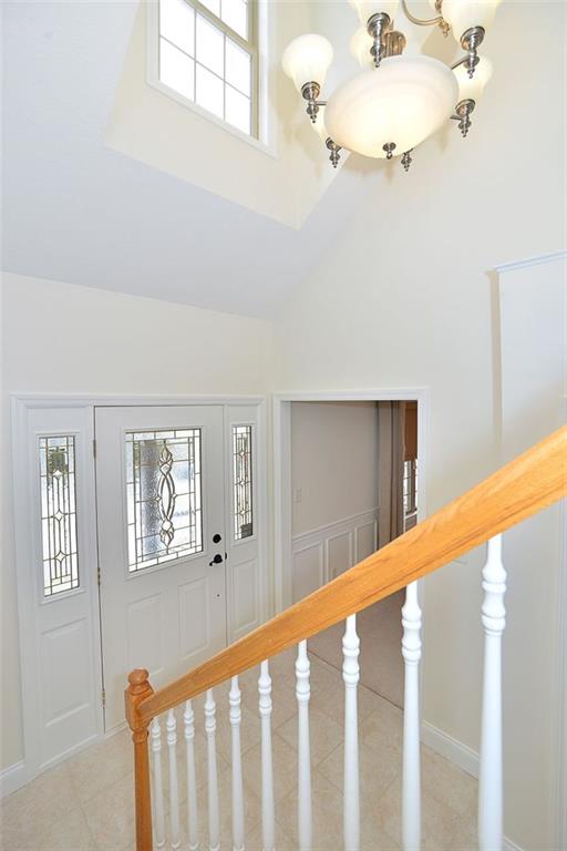 173 Warren Road Warrendale, PA 15086 - Photo 2 of 25 Step through the beautiful glass & lead custom front door, and onto ceramic floor, and you're in the elegant & spacious home Foyer.