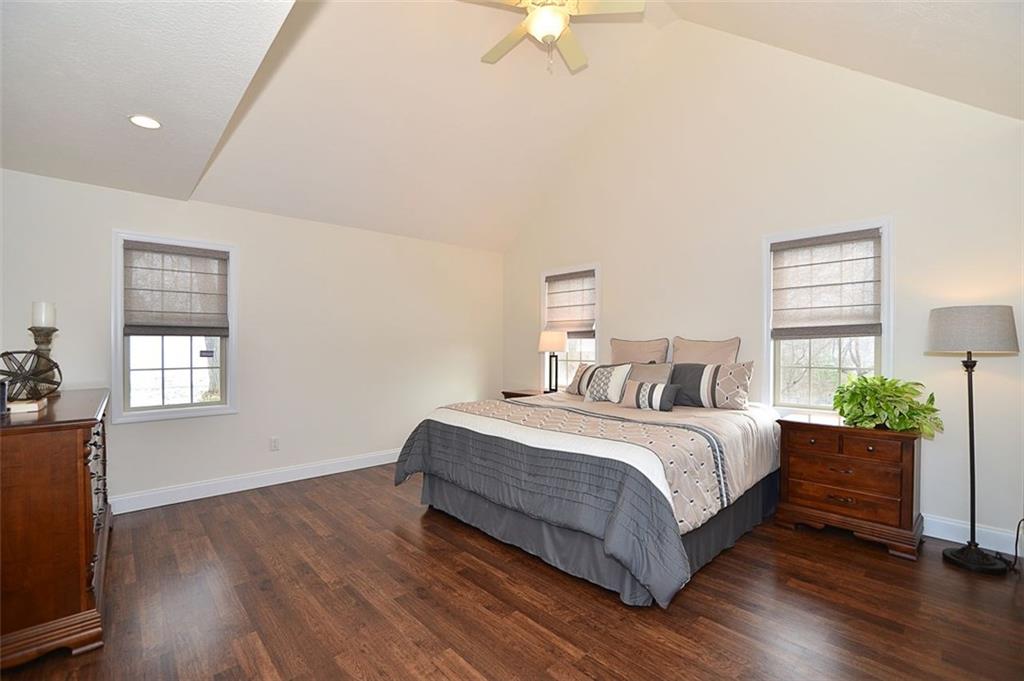 173 Warren Road Warrendale, PA 15086 - Photo 14 of 25 MAIN FLOOR Master Bedroom features vaulted ceiling, neutral color palate, laminate wood flooring, spacious dual closets and a beautiful En Suite Bath.