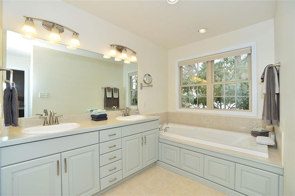 173 Warren Road Warrendale, PA 15086 - Photo 15 of 25 Master En Suite Bath features updated cabinets, neutral color palate, dual sinks, jet tub bathtub, shower, toilet, ceramic flooring and great lighting options.
