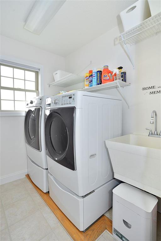 173 Warren Road Warrendale, PA 15086 - Photo 16 of 25 Main floor Laundry Room is conveniently located off the kitchen. Newer washer & dryer, utility sink, shelving and a cheery window too!