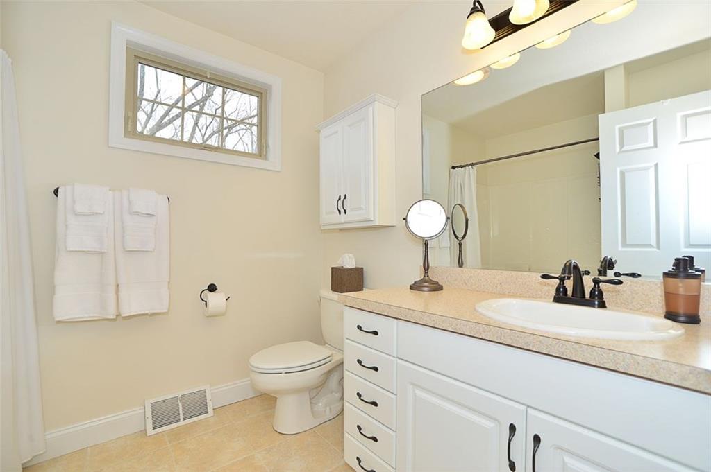 173 Warren Road Warrendale, PA 15086 - Photo 19 of 25 Upstairs FULL BATHROOM features a ceramic floor, tub/shower combo, plenty of cabinet storage and a privacy window.