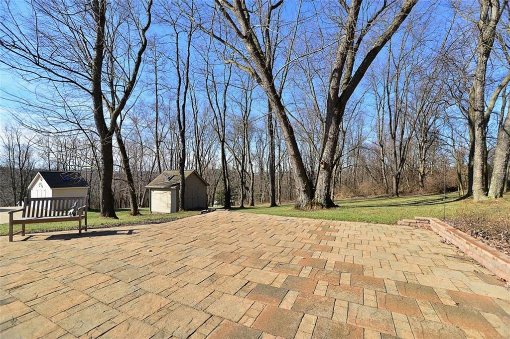 173 Warren Road Warrendale, PA 15086 - Photo 24 of 25 There's additional outdoor living on this rear patio that expands into the beautiful lawns & woodlands. Storage shed with skylight.