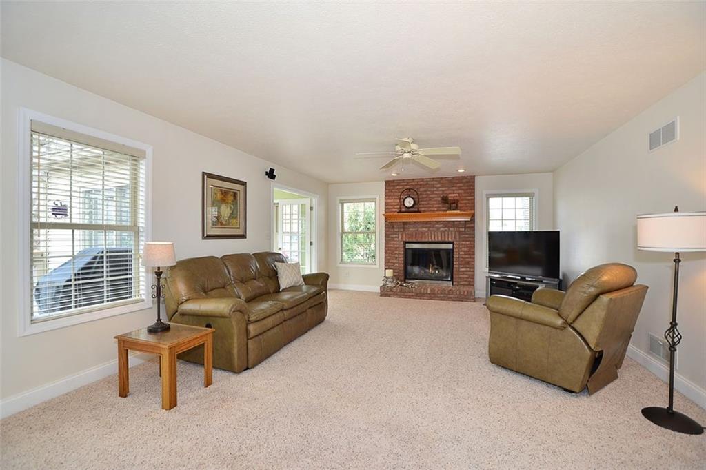 173 Warren Road Warrendale, PA 15086 - Photo 5 of 25 The Family Room, adjacent to the kitchen area, is very cheery with plenty of windows, a gas log fireplace and also connects to the 4 Seasons Room for additional indoor living area.