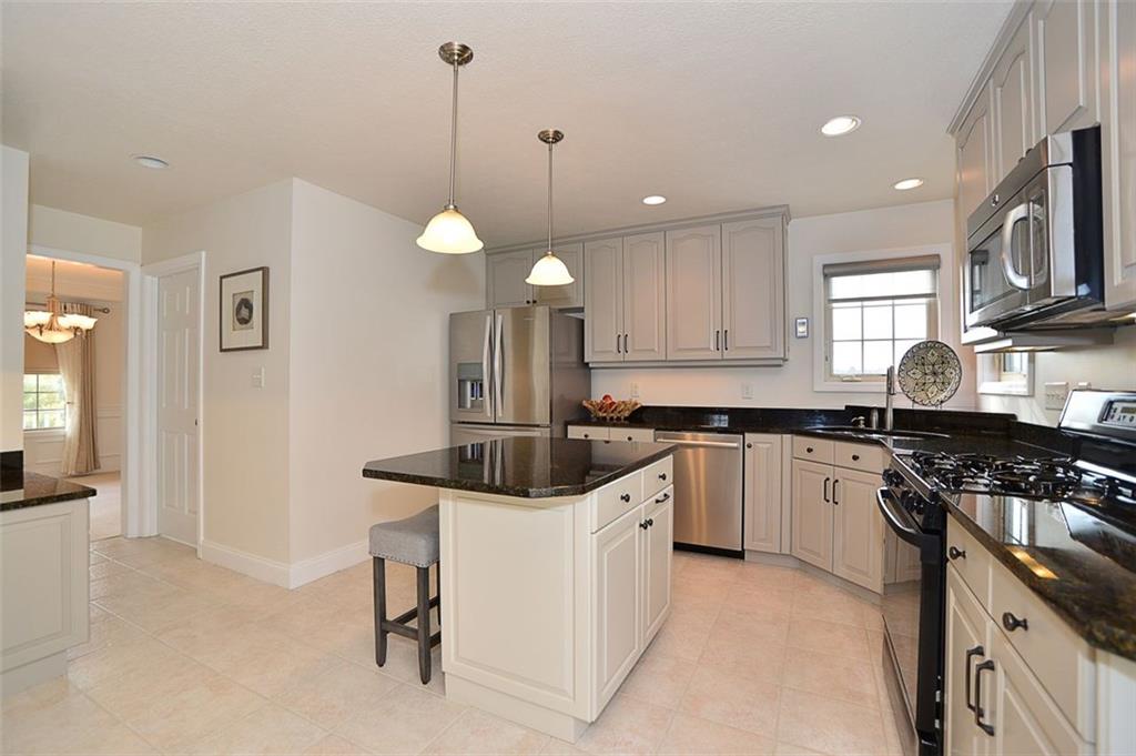 173 Warren Road Warrendale, PA 15086 - Photo 10 of 25 Kitchen features granite counter tops, high-end stainless steel refrigerator/dishwasher/microwave, a gas stove, ceramic flooring and wonderful lighting options.