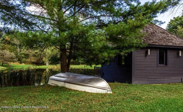 a view of a backyard with a small cabin