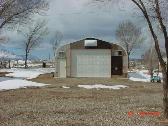 25716 Rd L Cortez, CO 81321 - Photo 2 of 4 a front view of a house with a yard