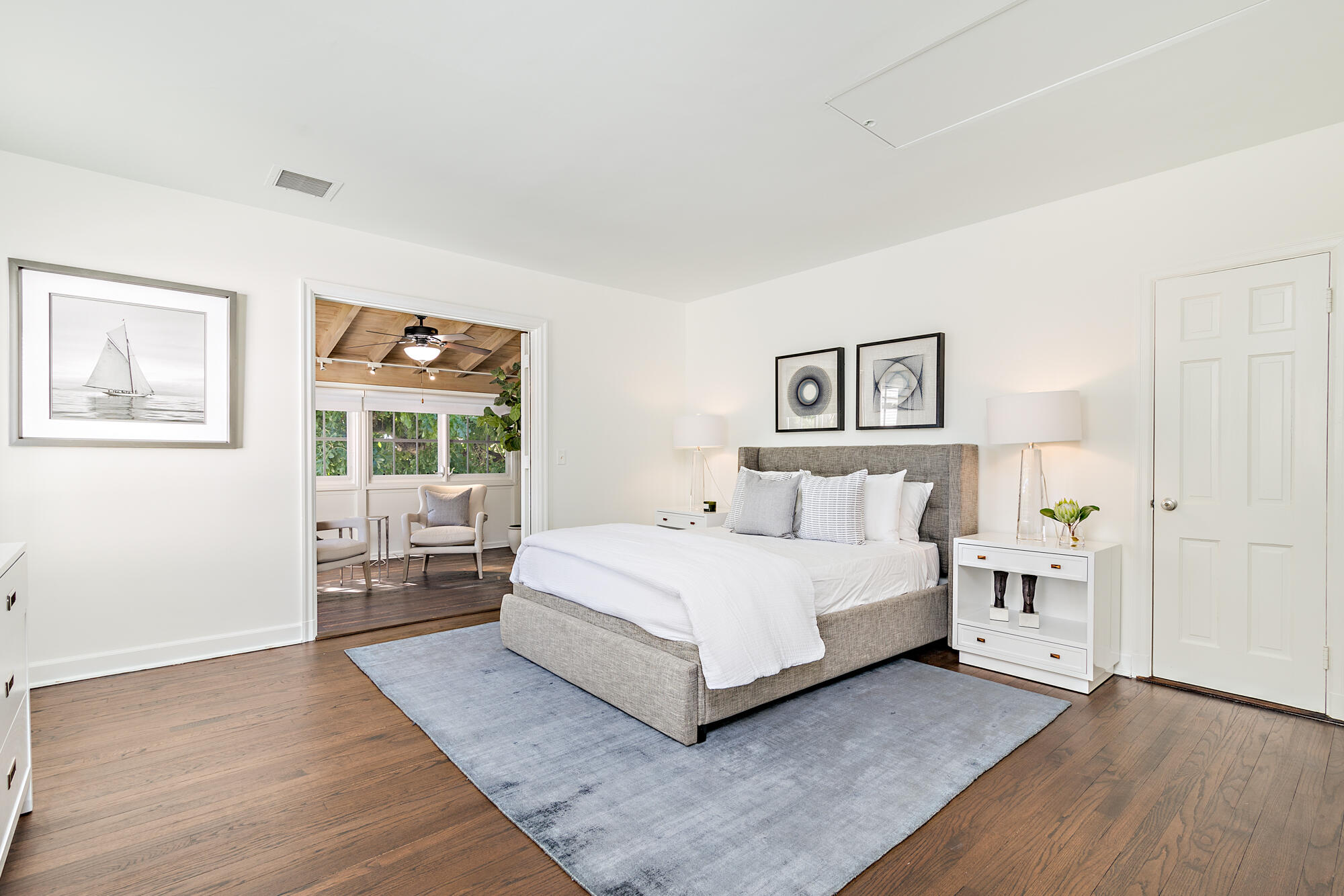 239 Emerald Lane Palm Beach, FL 33480 - Photo 8 of 29 a large bedroom with a bed and wooden floor