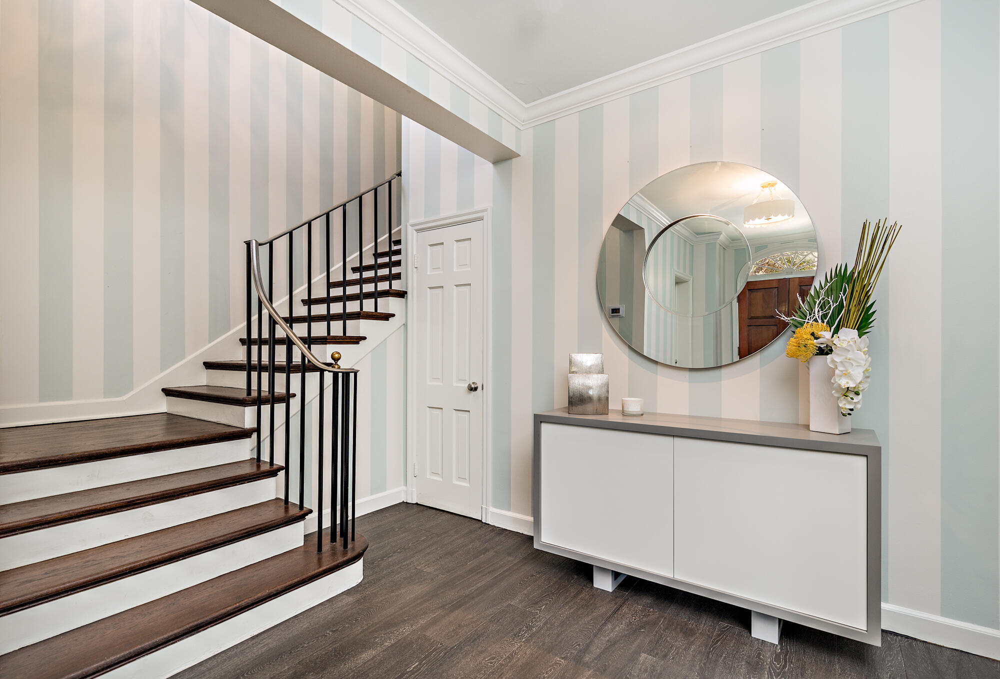 239 Emerald Lane Palm Beach, FL 33480 - Photo 20 of 29 a view of a hallway with wooden floor and staircase