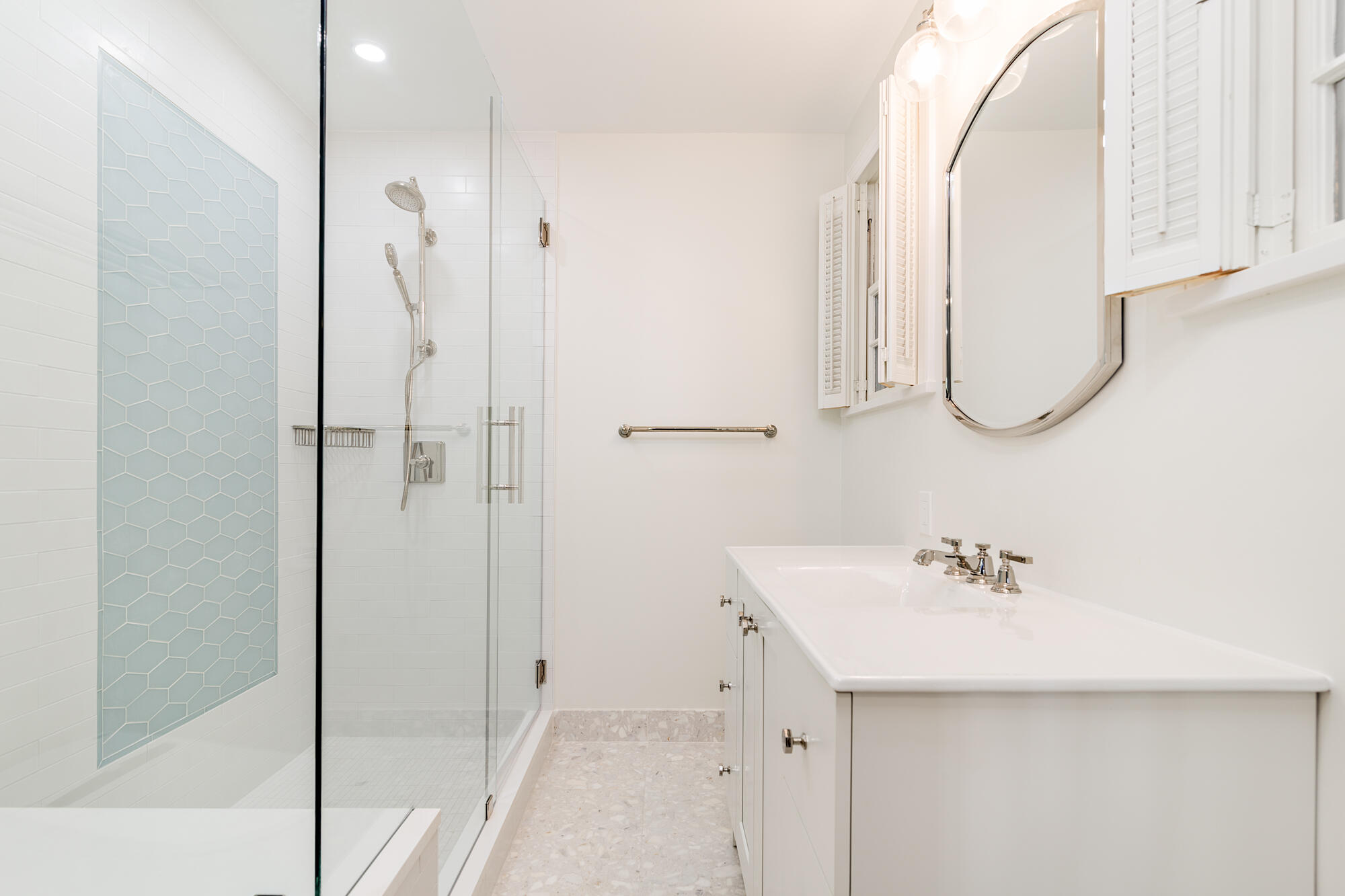239 Emerald Lane Palm Beach, FL 33480 - Photo 7 of 29 a bathroom with a sink a mirror and shower