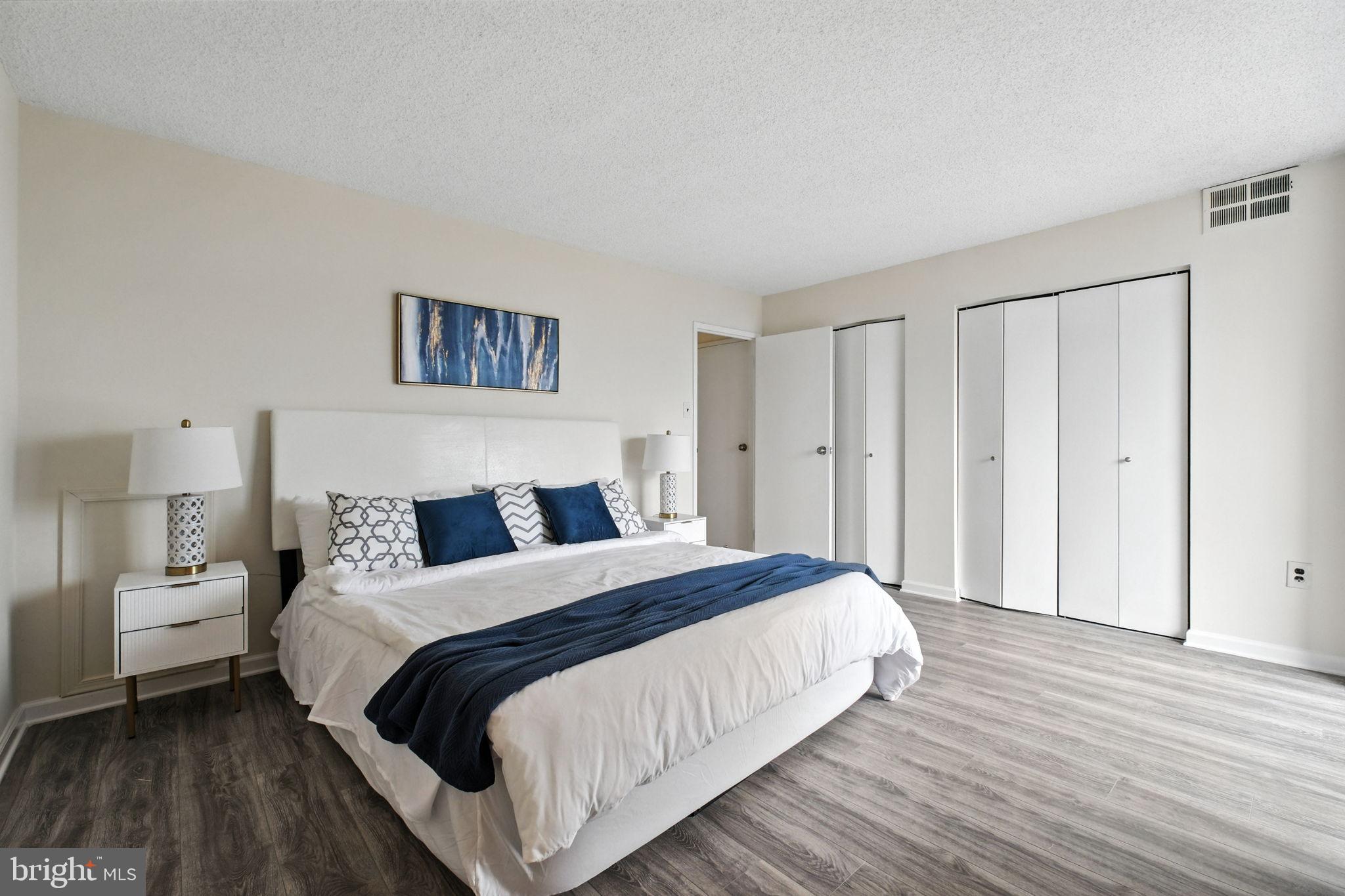 5300 Holmes Run Parkway, Unit 1210 Alexandria, VA 22304 - Photo 13 of 33 a bedroom with a bed and a night stand