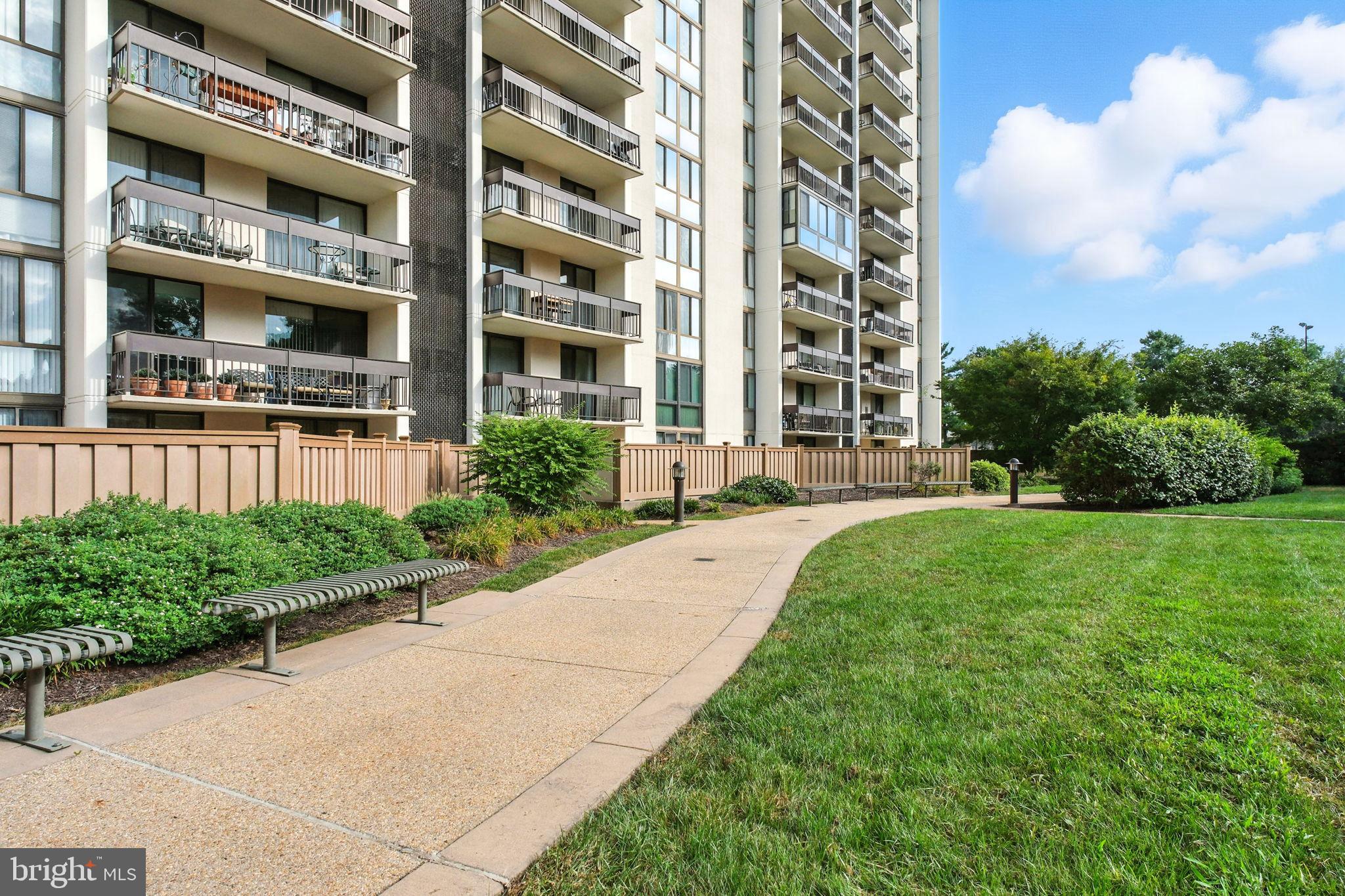 5300 Holmes Run Parkway, Unit 1210 Alexandria, VA 22304 - Photo 23 of 33 a front view of a building with a garden