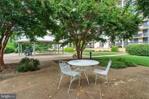 a view of a tables and chairs in a yard