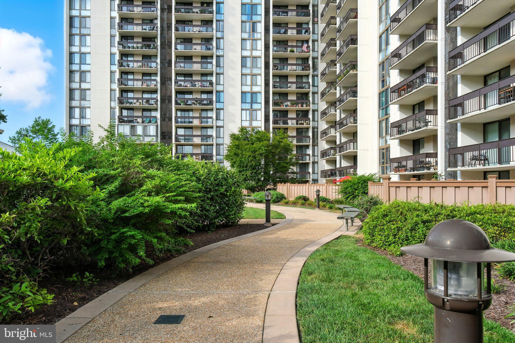 5300 Holmes Run Parkway, Unit 1210 Alexandria, VA 22304 - Photo 29 of 33 a view of a patio with plants and palm trees