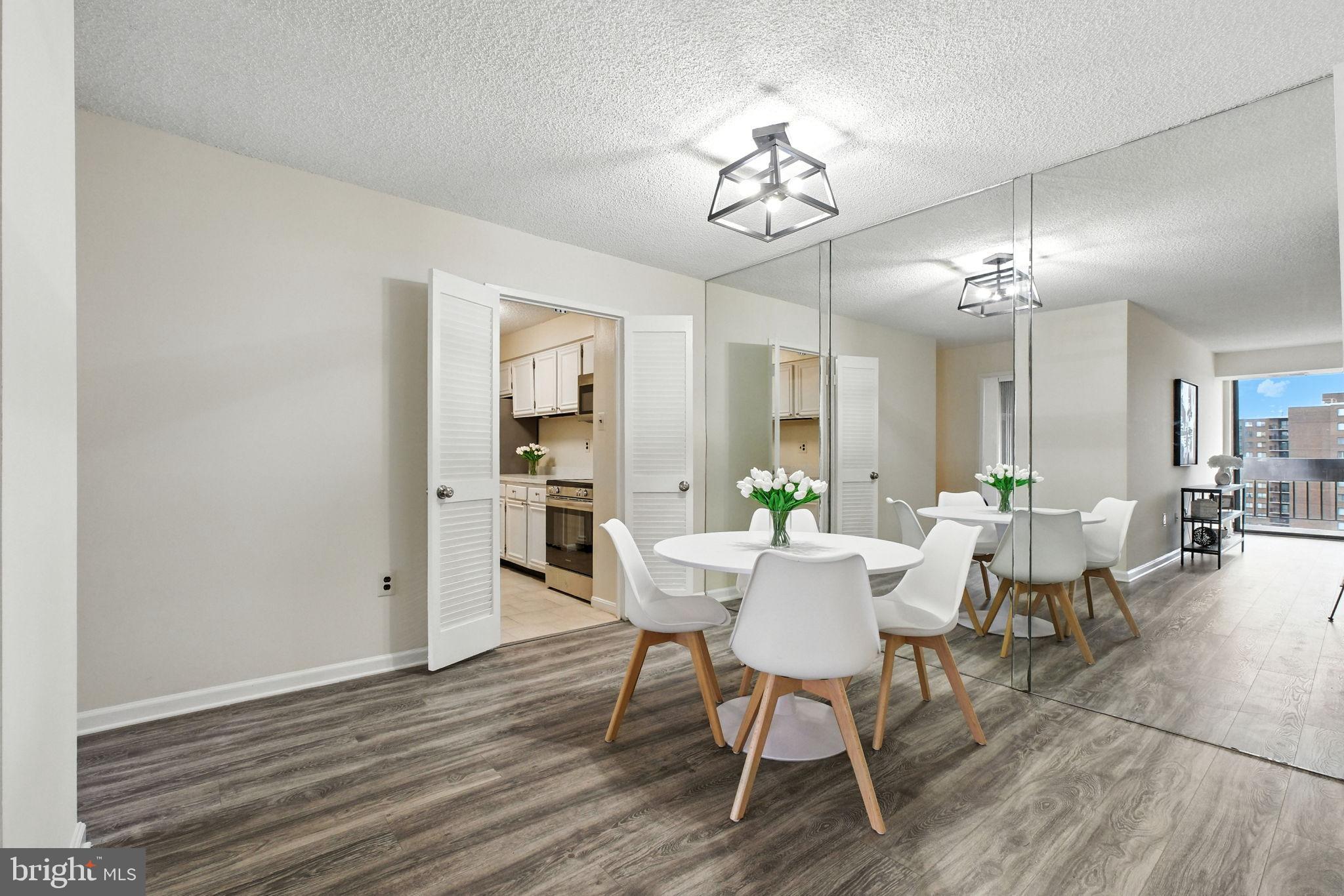 5300 Holmes Run Parkway, Unit 1210 Alexandria, VA 22304 - Photo 5 of 33 a view of a dining room with furniture and wooden floor
