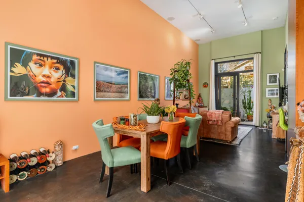 a view of a livingroom with furniture and a potted plant