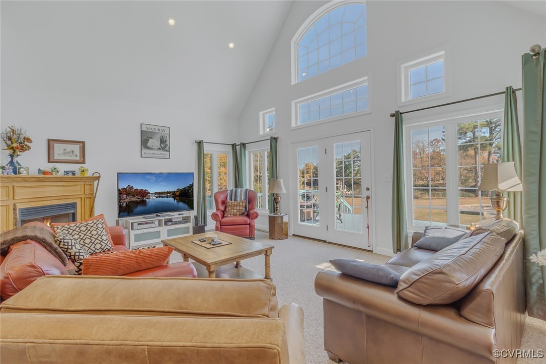 1843 Fairport Road Reedville, VA 22539 - Photo 20 of 43 Living room featuring carpet flooring, high vaulte