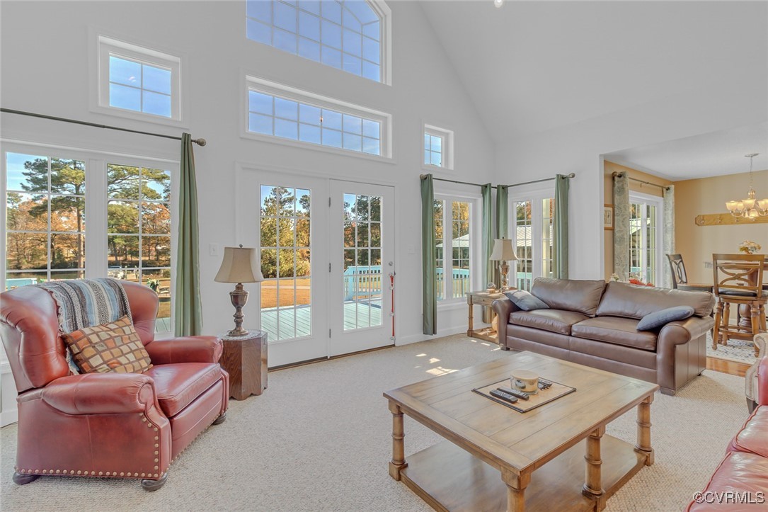 1843 Fairport Road Reedville, VA 22539 - Photo 26 of 43 Living room featuring carpet, a high ceiling, and