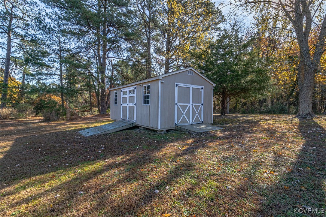 1843 Fairport Road Reedville, VA 22539 - Photo 42 of 43 View of outbuilding with a yard