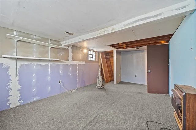 a view of a room with wooden walls