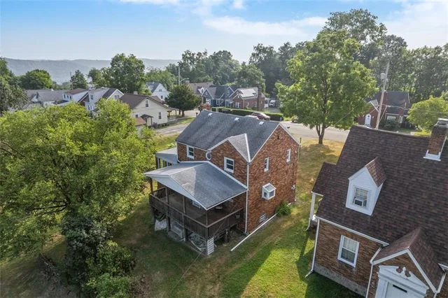 an aerial view of a house with a garden