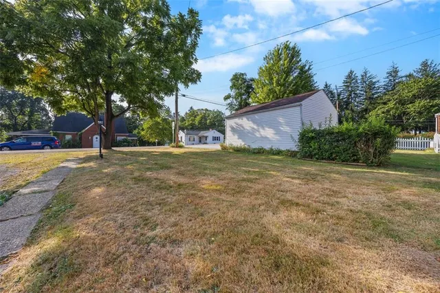 a view of a tree in front of a house