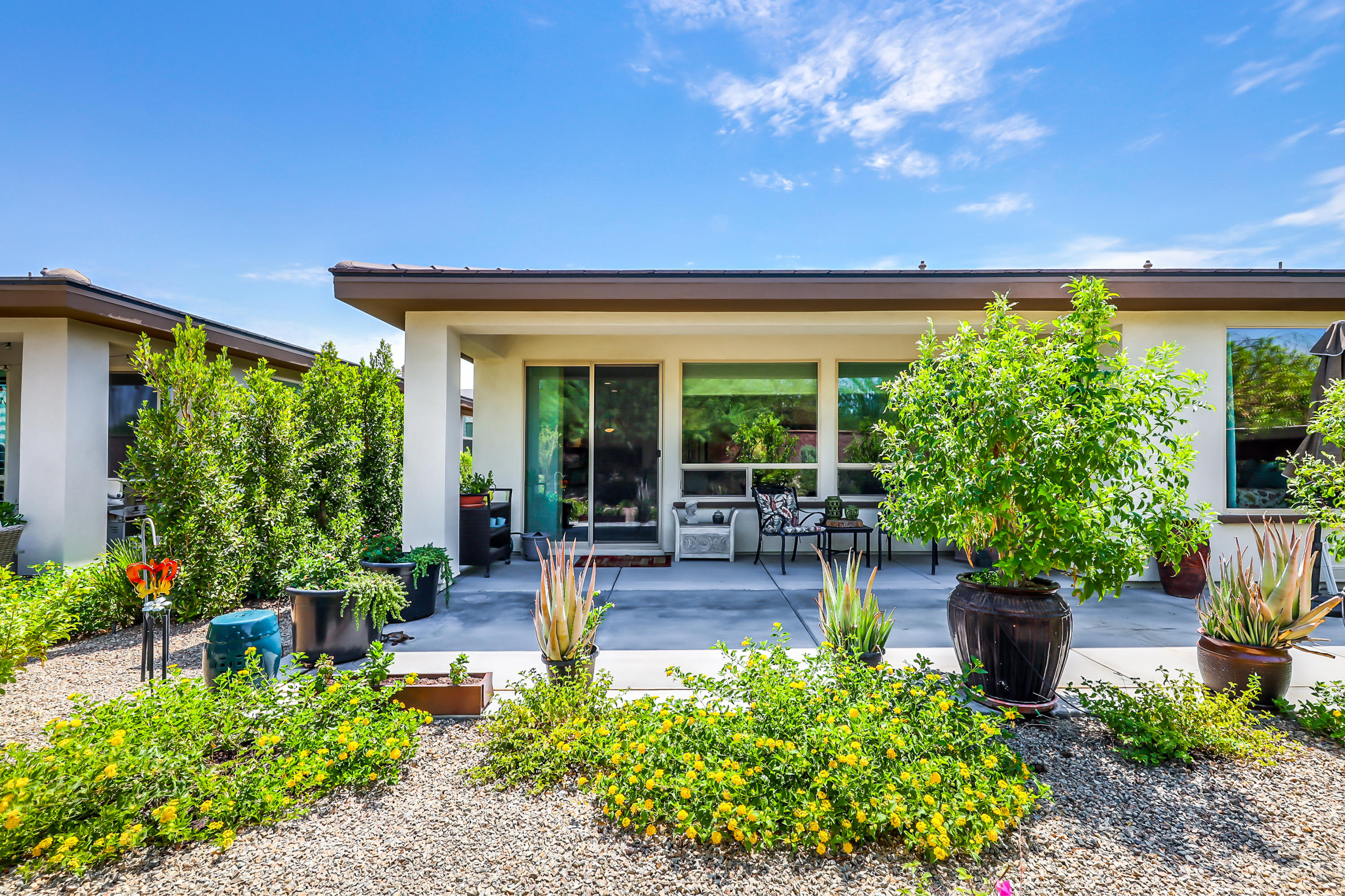 51731 Golden Eagle Drive Indio, CA 92201 - Photo 22 of 28 a house view with a seating space and garden view
