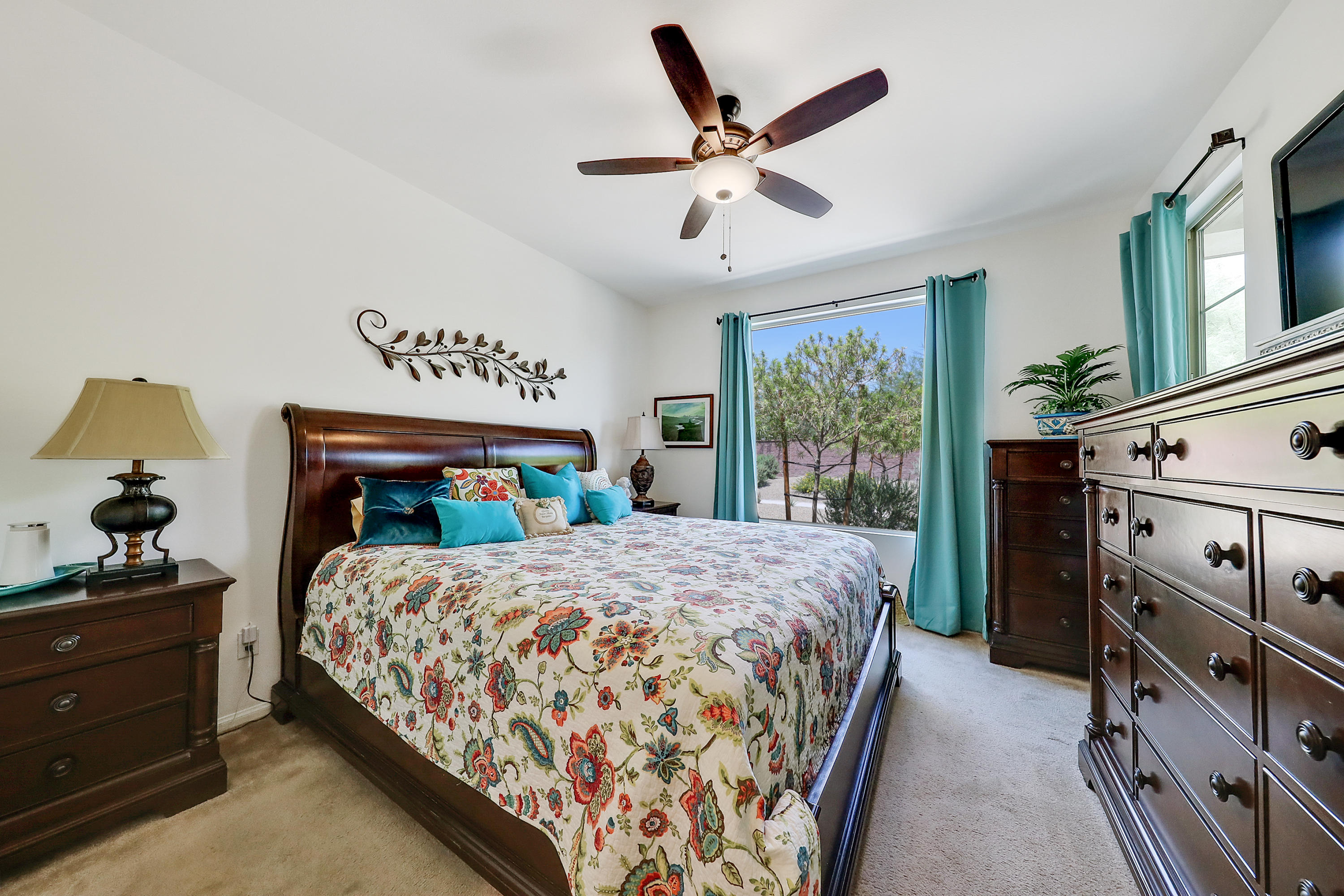 51731 Golden Eagle Drive Indio, CA 92201 - Photo 9 of 28 a bedroom with a large bed and a window