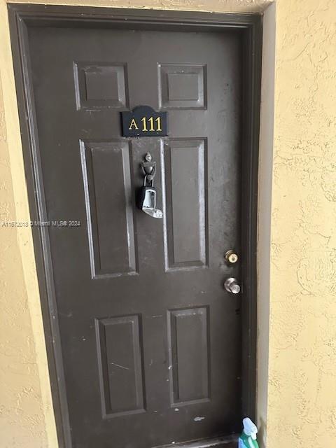 3985 West McNab Road, Unit A111 Pompano Beach, FL 33069 - Photo 1 of 36 a view of door