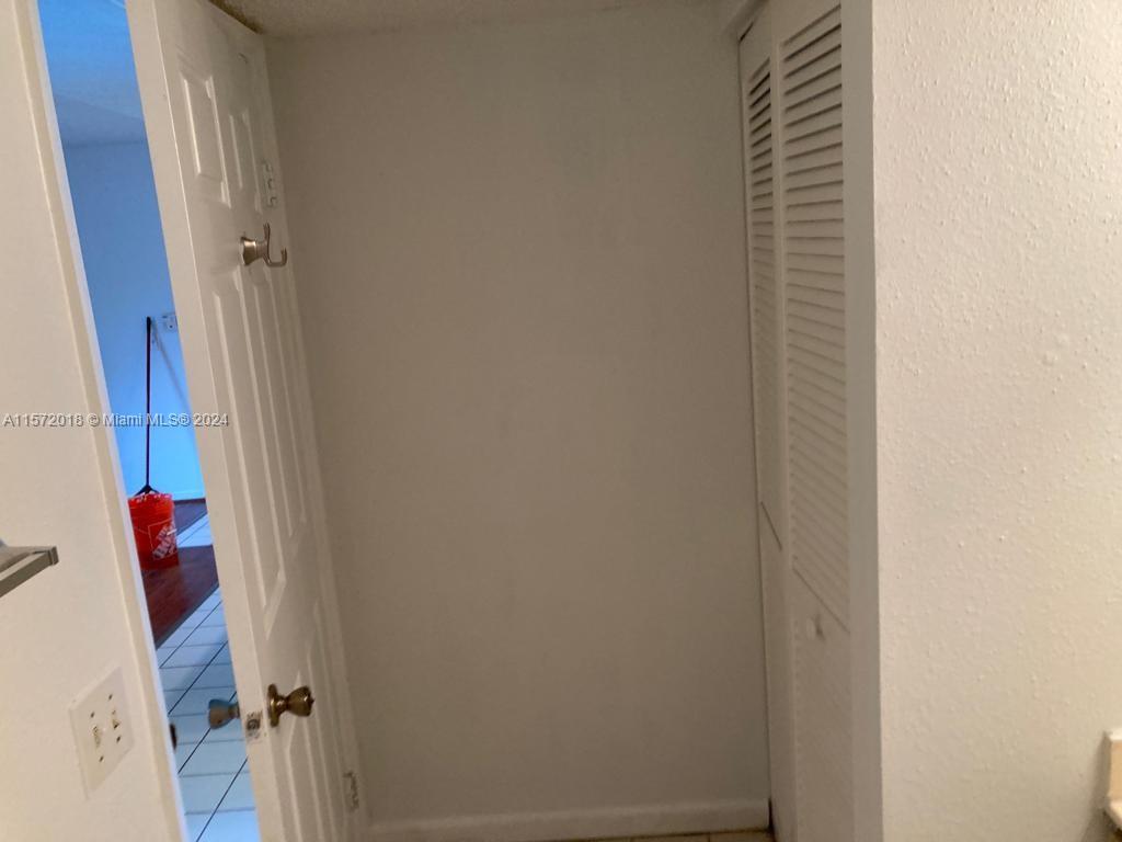 3985 West McNab Road, Unit A111 Pompano Beach, FL 33069 - Photo 19 of 36 a bathroom with a shower and a sink