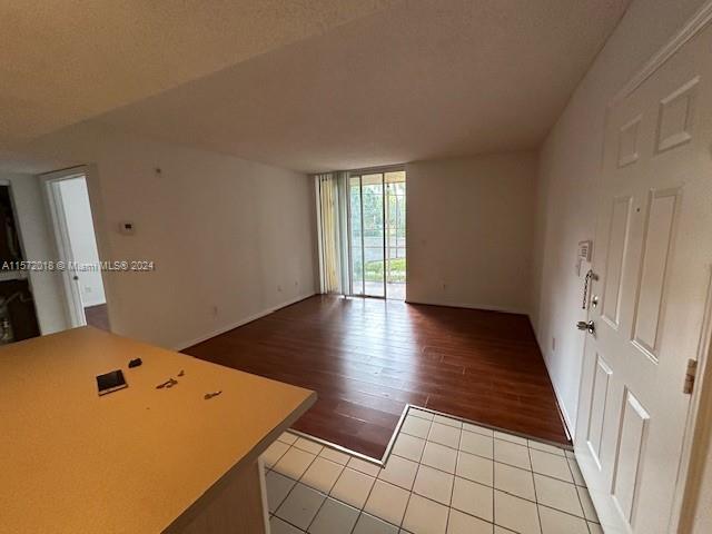 3985 West McNab Road, Unit A111 Pompano Beach, FL 33069 - Photo 26 of 36 wooden floor in an empty room with a window