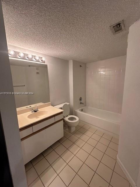 3985 West McNab Road, Unit A111 Pompano Beach, FL 33069 - Photo 32 of 36 a bathroom with a granite countertop sink a toilet and shower