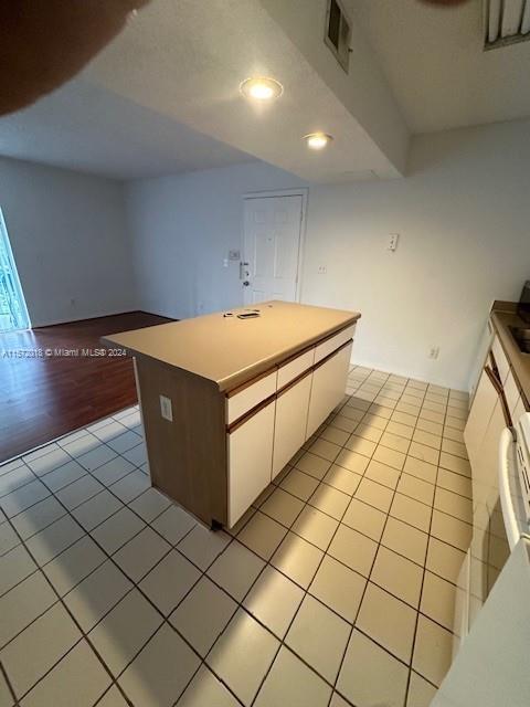 3985 West McNab Road, Unit A111 Pompano Beach, FL 33069 - Photo 35 of 36 a room with a wooden floor