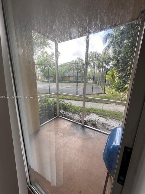 3985 West McNab Road, Unit A111 Pompano Beach, FL 33069 - Photo 36 of 36 a view of a room with wooden floor and fence