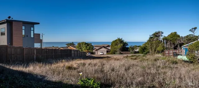 a view of a houses with a lake view