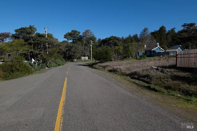 a view of a street with a houses