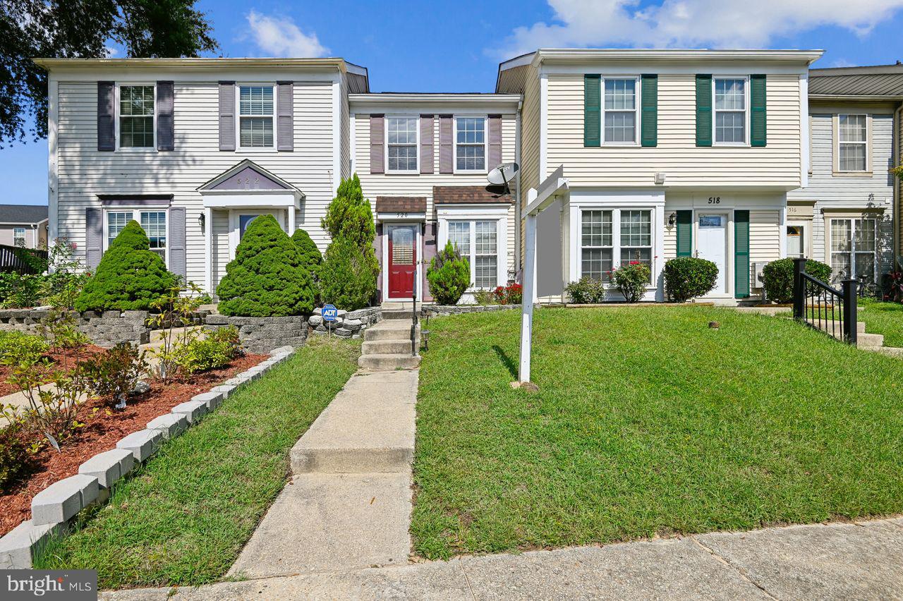520 Bend Circle Road Glen Burnie, MD 21061 - Photo 1 of 23 a front view of a residential apartment building with a yard