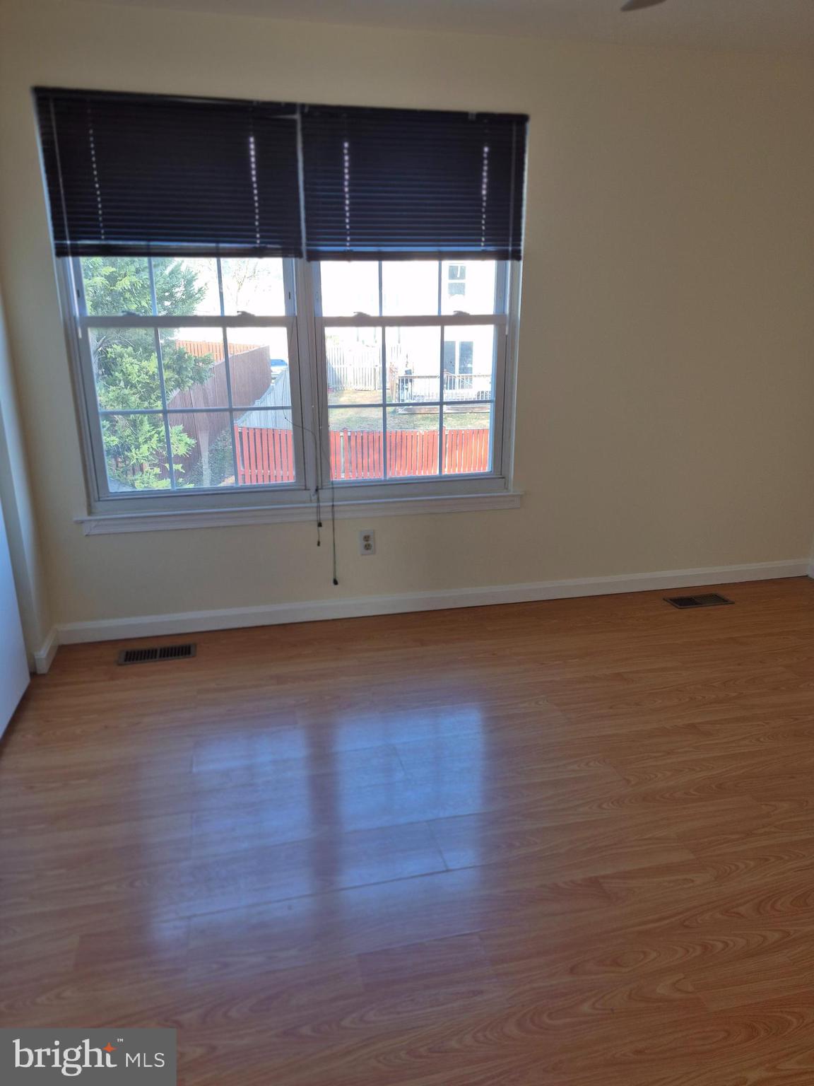 520 Bend Circle Road Glen Burnie, MD 21061 - Photo 20 of 23 an empty room with wooden floor and windows