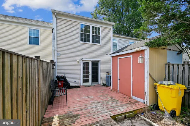 a view of a terrace with wooden floor and fence