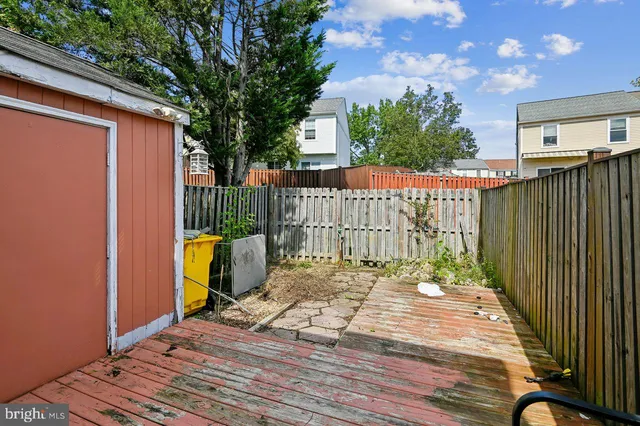 a view of a house with wooden deck