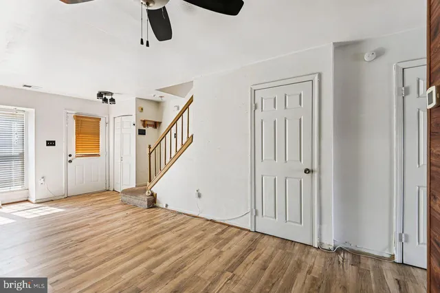 a view of an entryway with wooden floor
