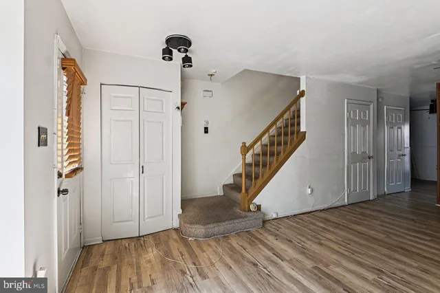a view of an entryway with wooden floor