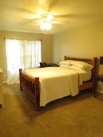 a bedroom with a bed and a cabinets