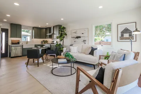 a living room with furniture and a table