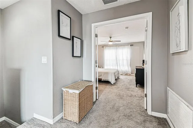 a room with a bed and a view of bathroom