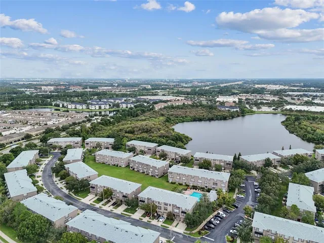 an aerial view of a house with a lake view