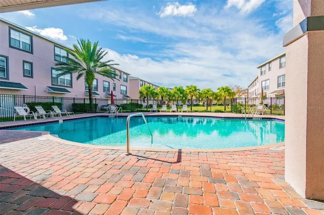 a view of a garden with a building in the background